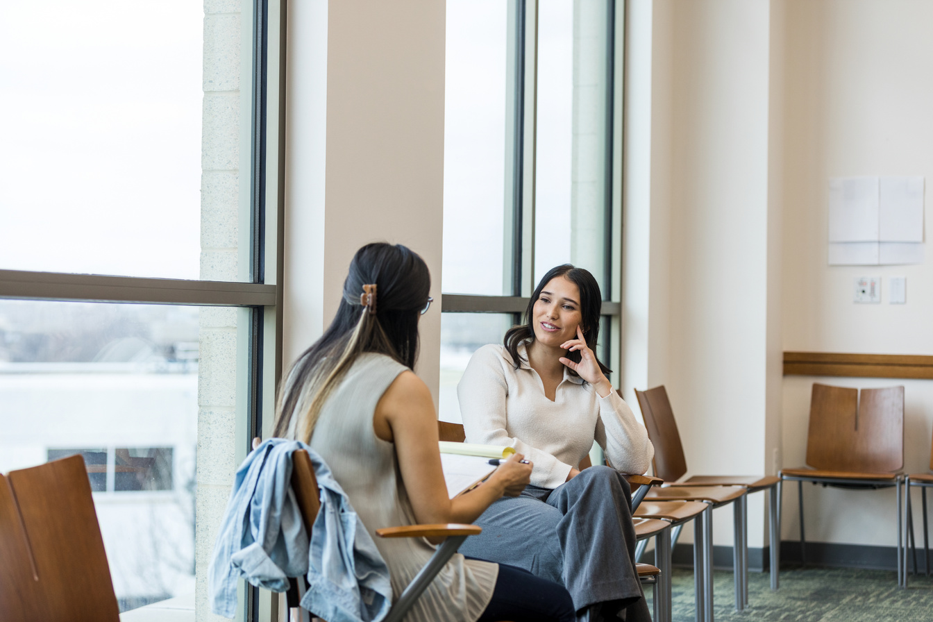 Female supervisors meet to review performance criteria together